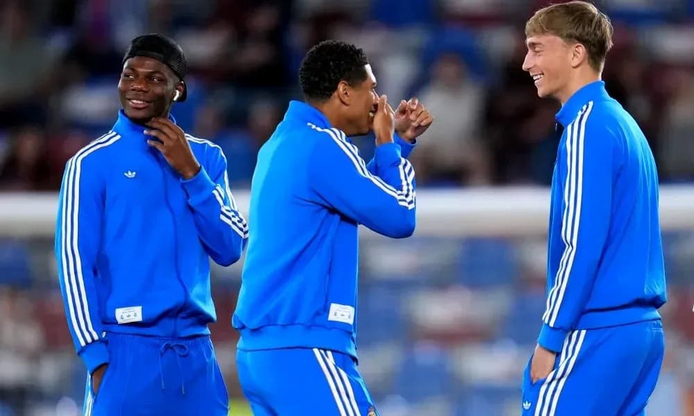 Three players laughing during warm-up session Three players laughing during warm-up session