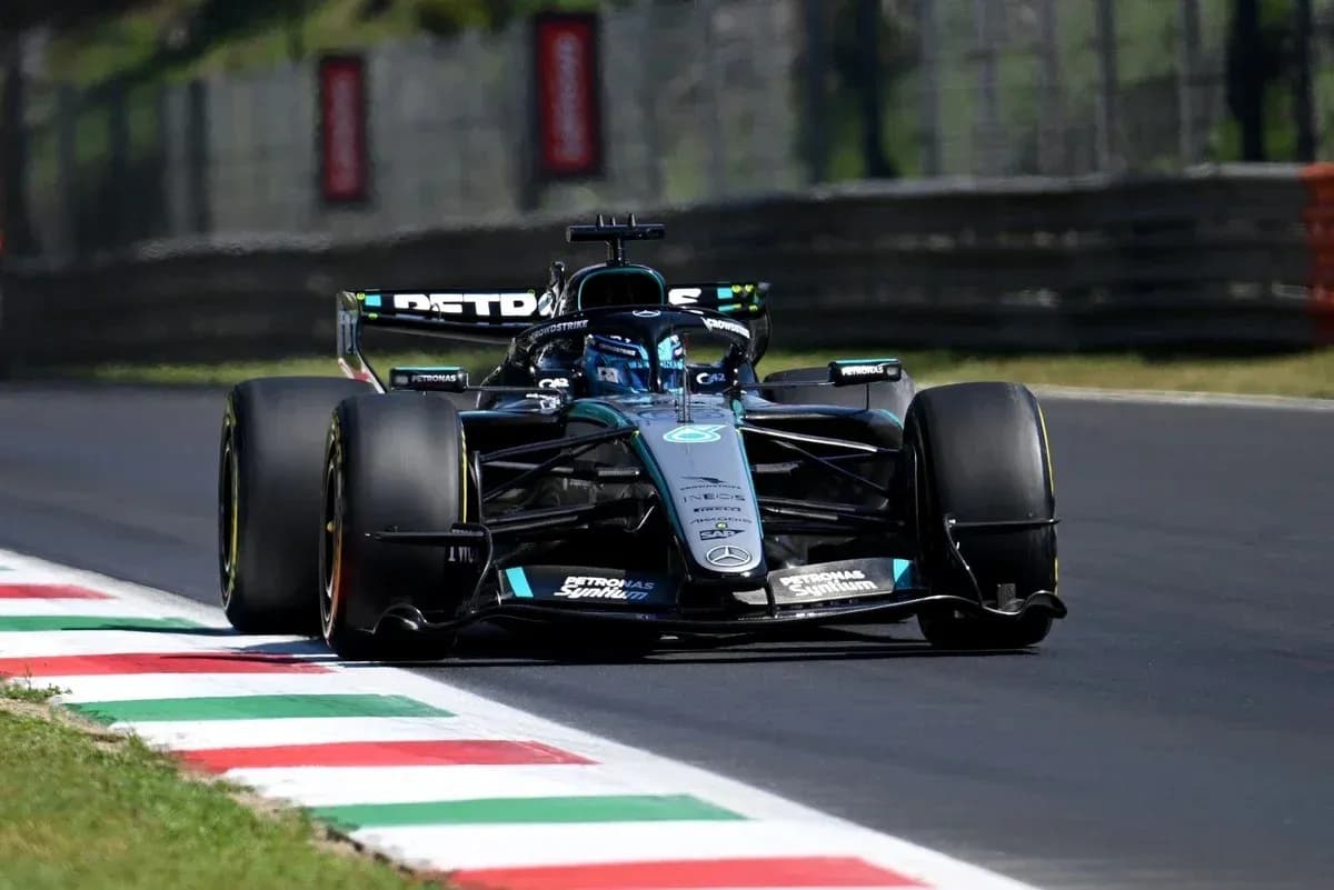 Mercedes Formula 1 car driving on racetrack Mercedes Formula 1 car driving on racetrack