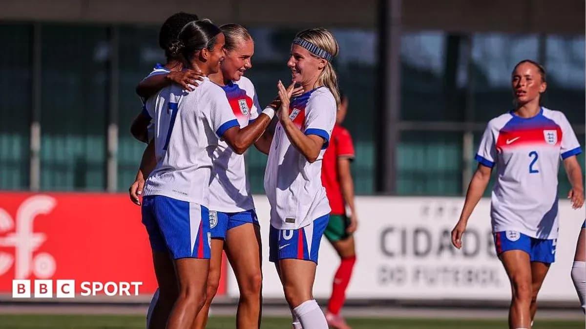 England women's team celebrating a goal on field England women's team celebrating a goal on field