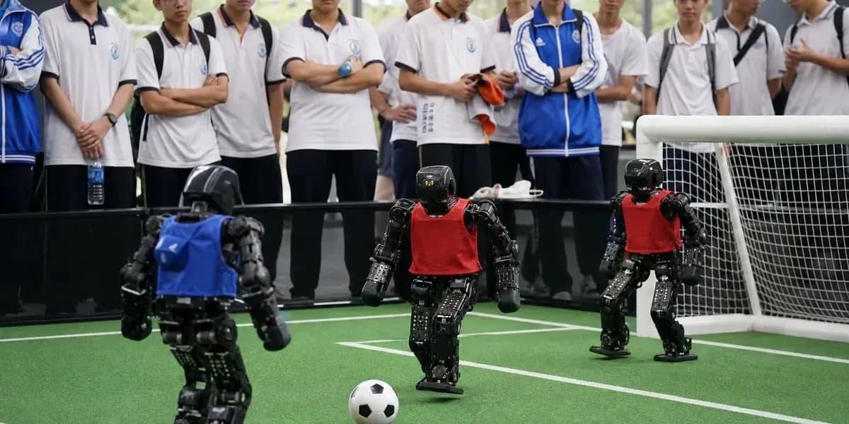 Robot soccer match with audience observing Robot soccer match with audience observing