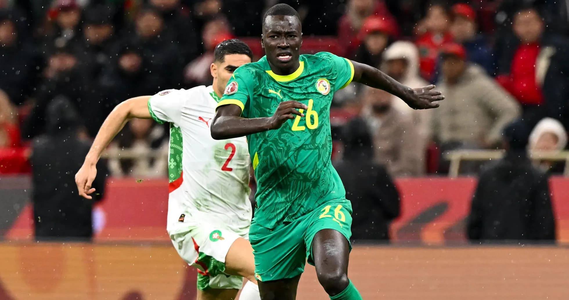 Senegal player sprinting during match against Morocco Senegal player sprinting during match against Morocco