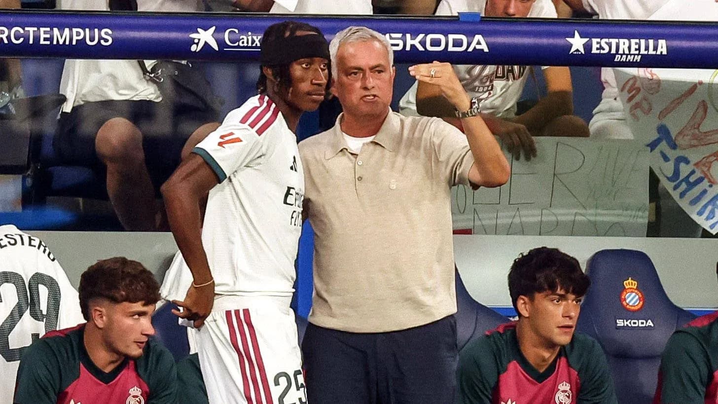 Mourinho giving instructions to player on bench Mourinho giving instructions to player on bench
