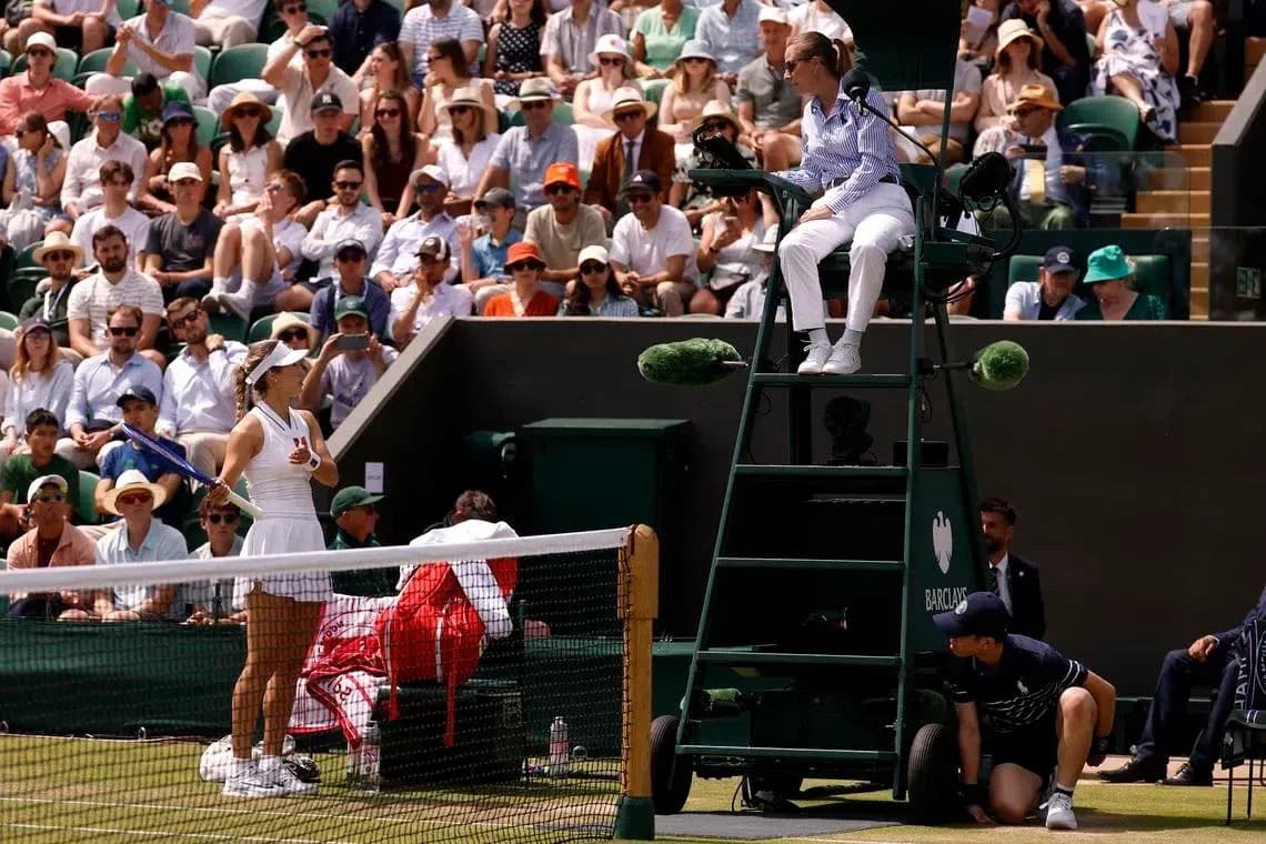 Tennis match with player and umpire at Wimbledon Tennis match with player and umpire at Wimbledon
