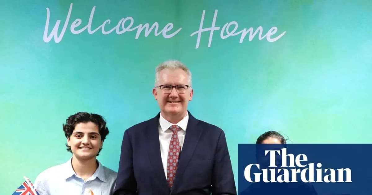 Three individuals posing in front of a welcome banner Three individuals posing in front of a welcome banner