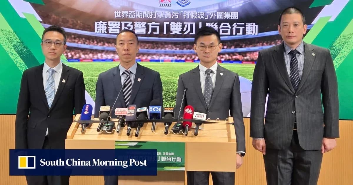 Four officials at a press conference with microphones Four officials at a press conference with microphones