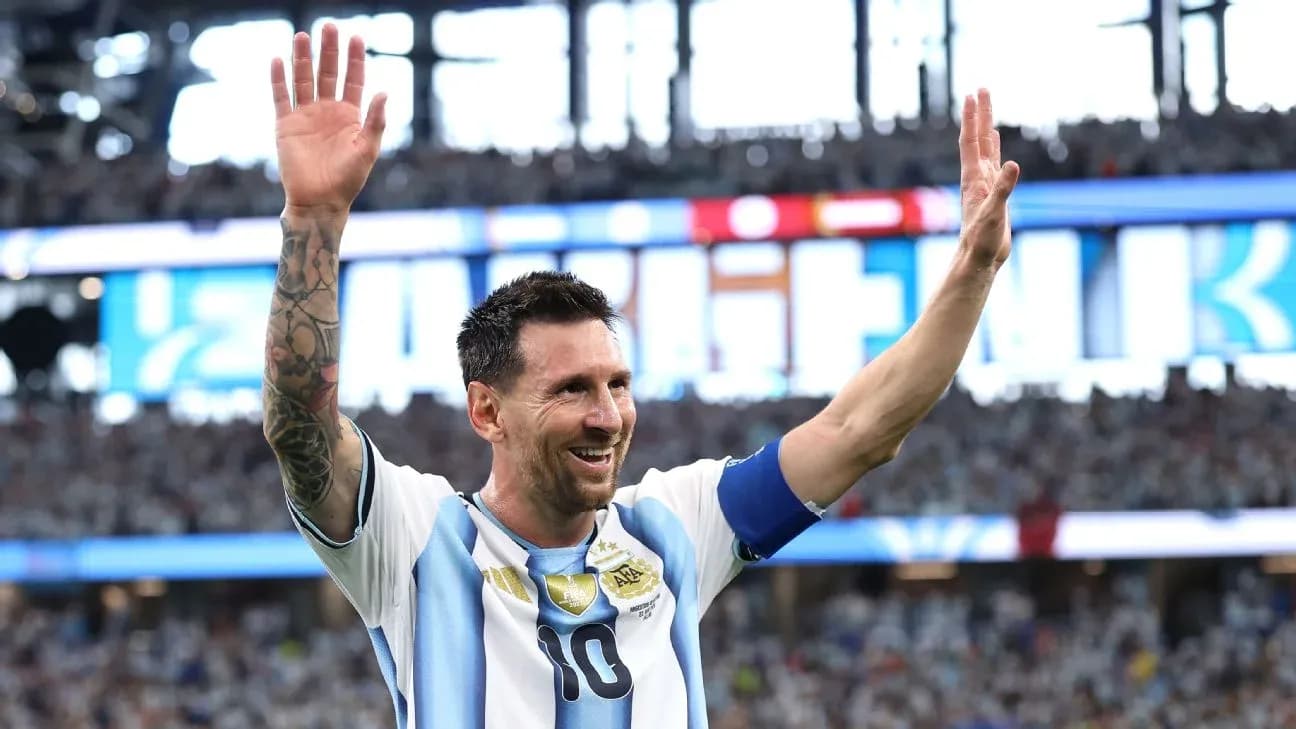 Lionel Messi waving to fans in stadium Lionel Messi waving to fans in stadium