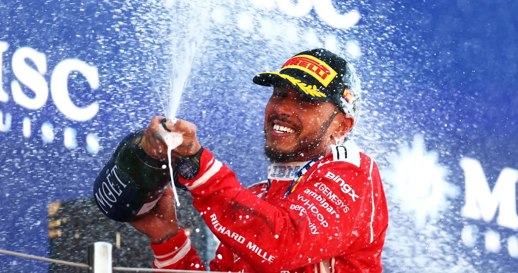 Driver spraying champagne on podium celebration Driver spraying champagne on podium celebration