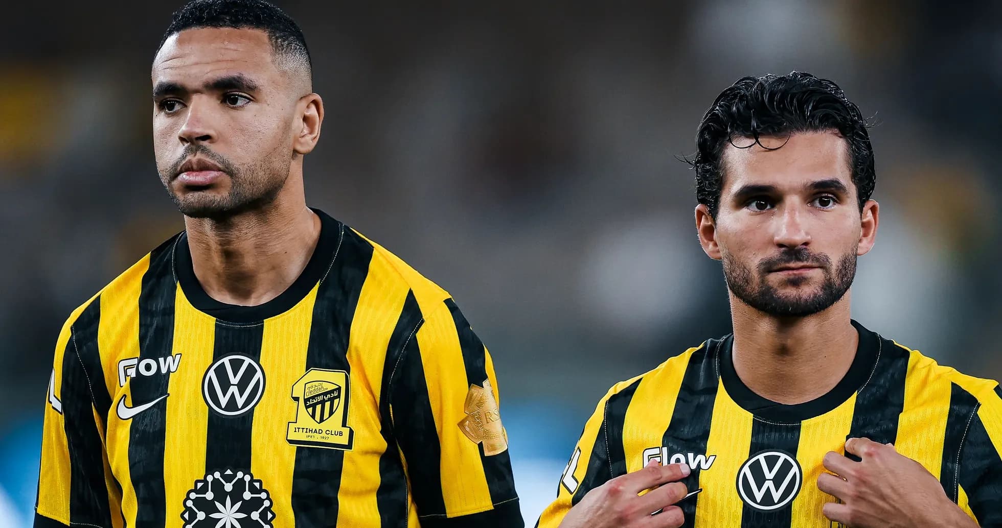 Ittihad Club players in yellow and black uniforms Ittihad Club players in yellow and black uniforms