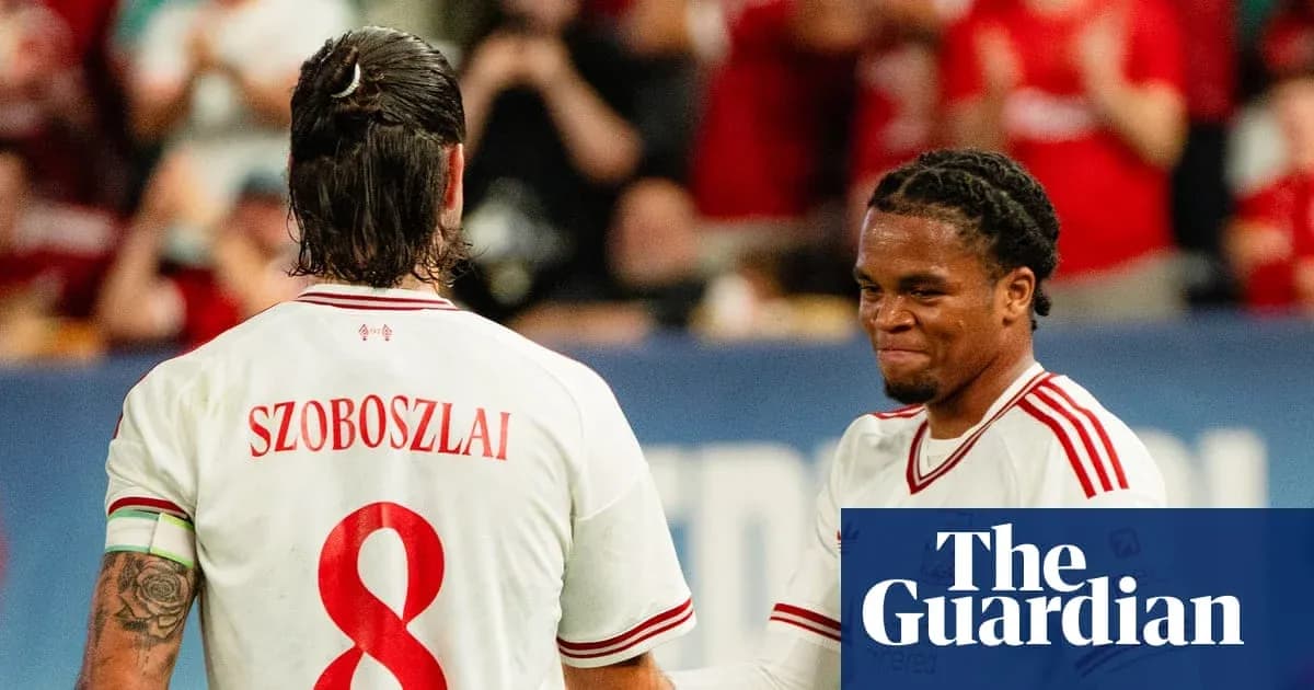 Two football players celebrating during a match Two football players celebrating during a match