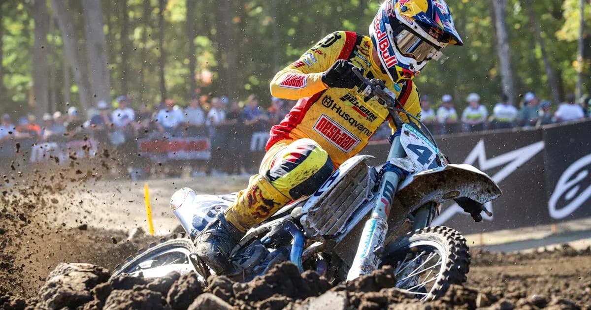 Motocross rider navigating a dirt track Motocross rider navigating a dirt track