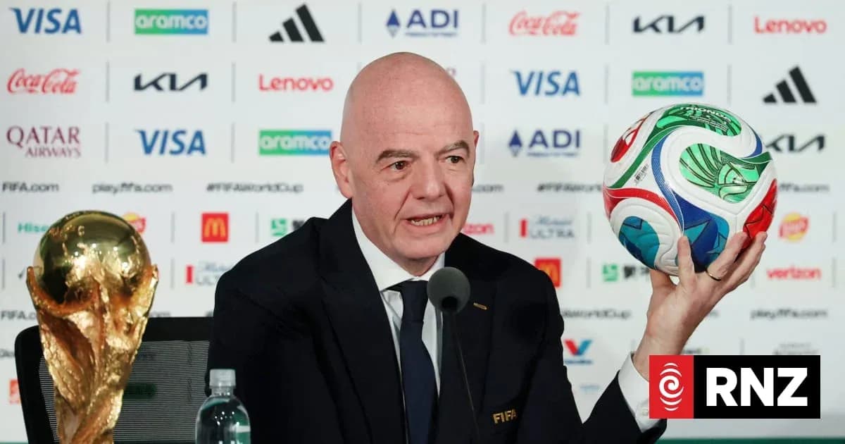 FIFA official presenting World Cup trophy and ball FIFA official presenting World Cup trophy and ball
