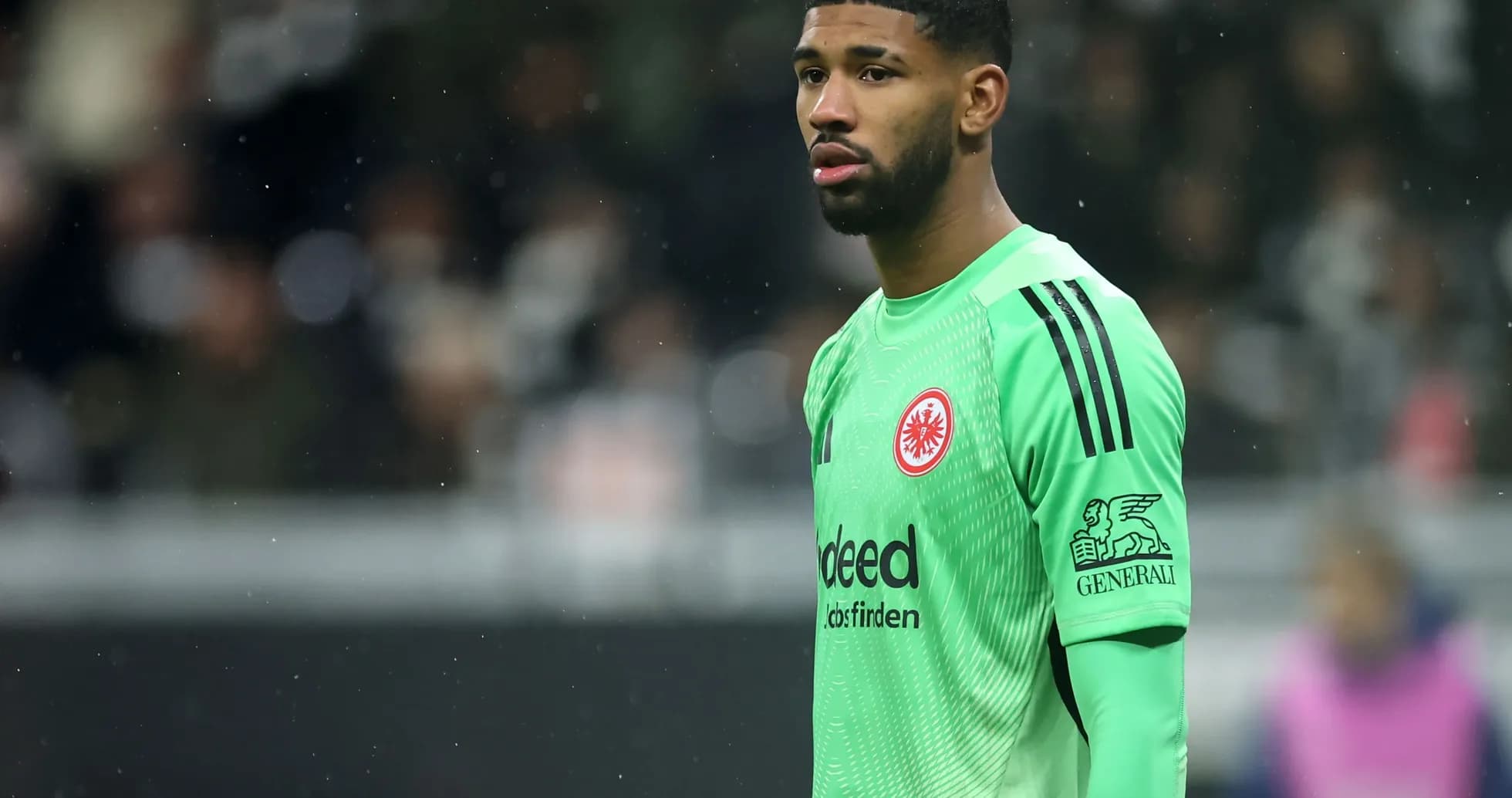 Goalkeeper in green kit during match Goalkeeper in green kit during match