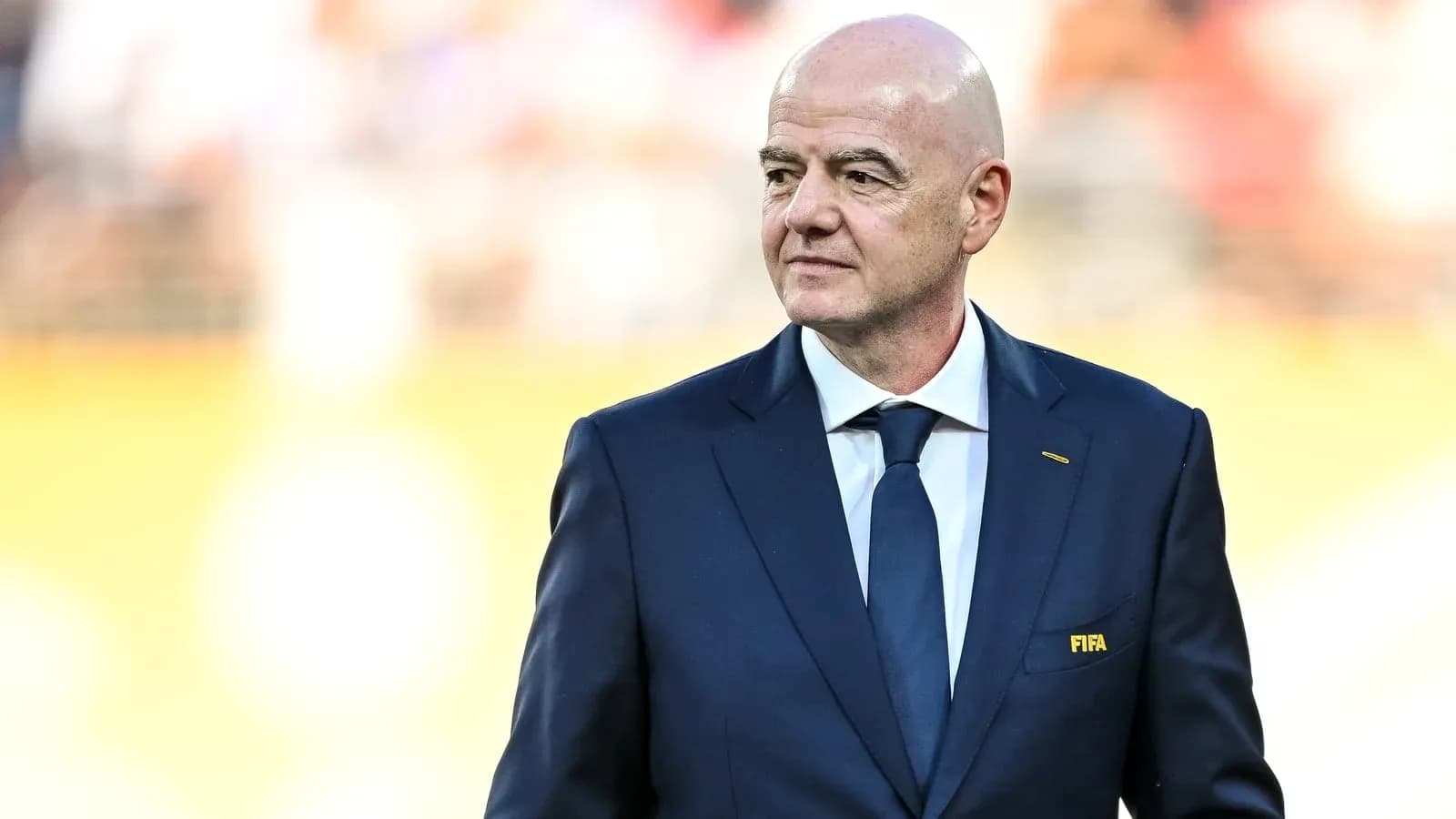FIFA president walking on the pitch before match FIFA president walking on the pitch before match