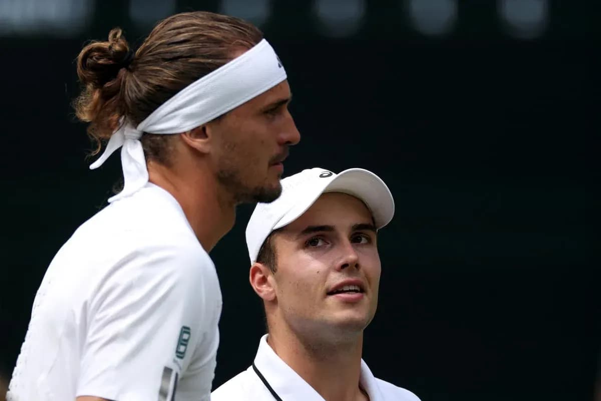 Tennis players discussing during match on court Tennis players discussing during match on court