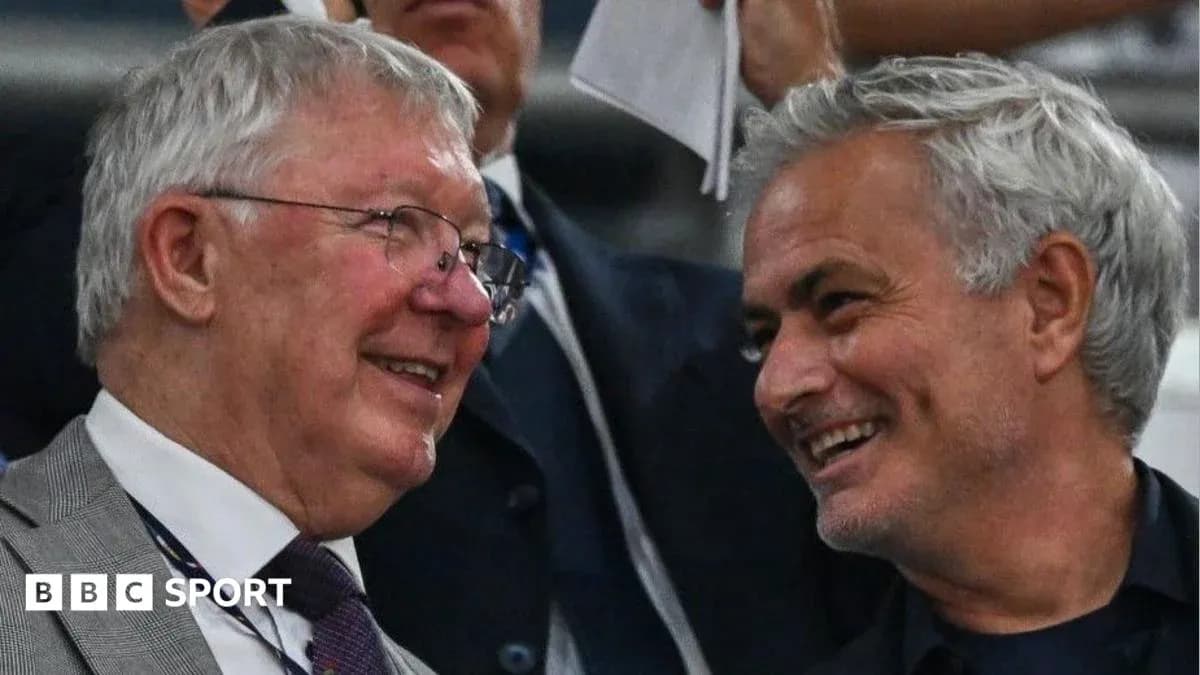 Two men smiling and chatting in a stadium Two men smiling and chatting in a stadium