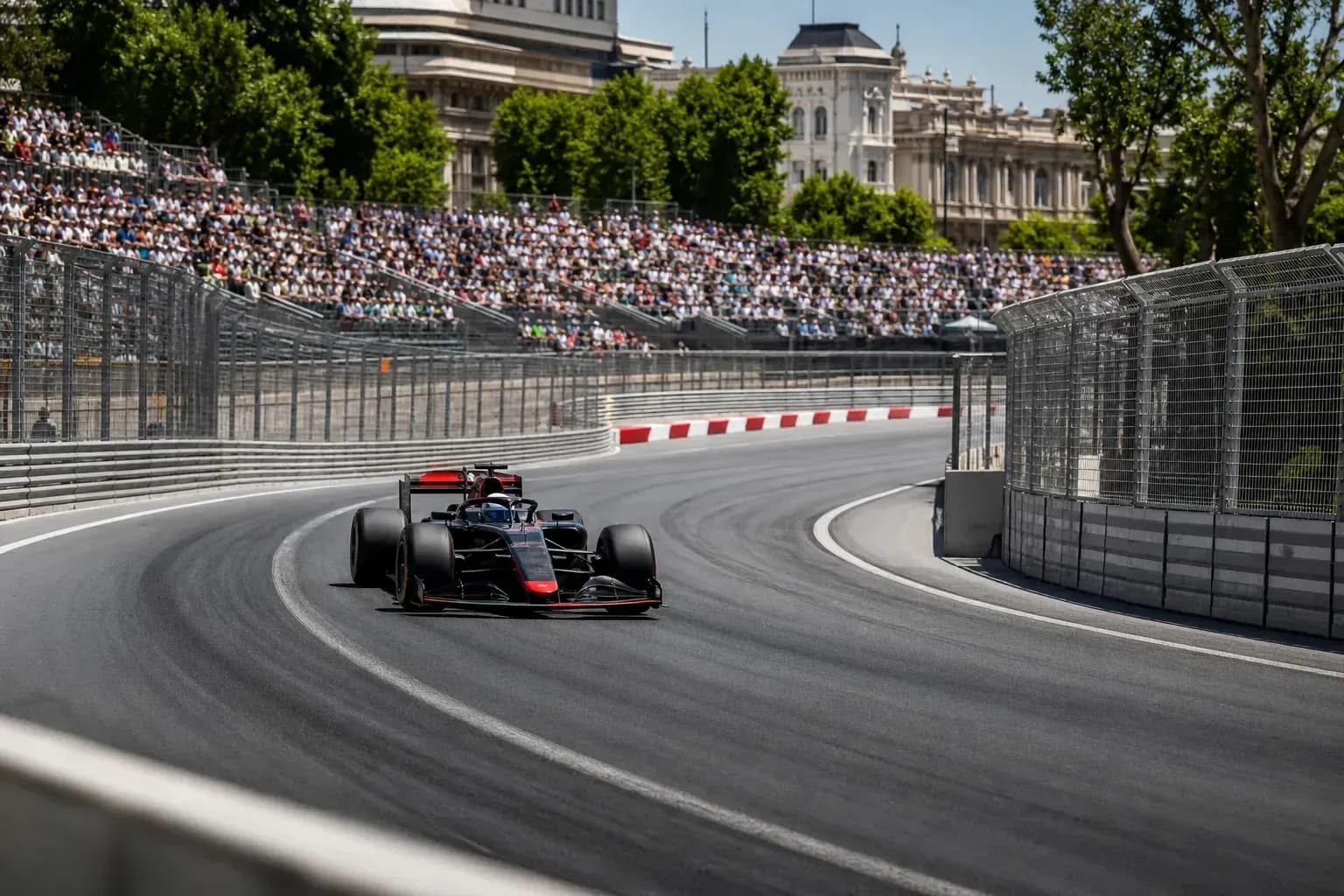 Formula 1 car racing on a curved track Formula 1 car racing on a curved track