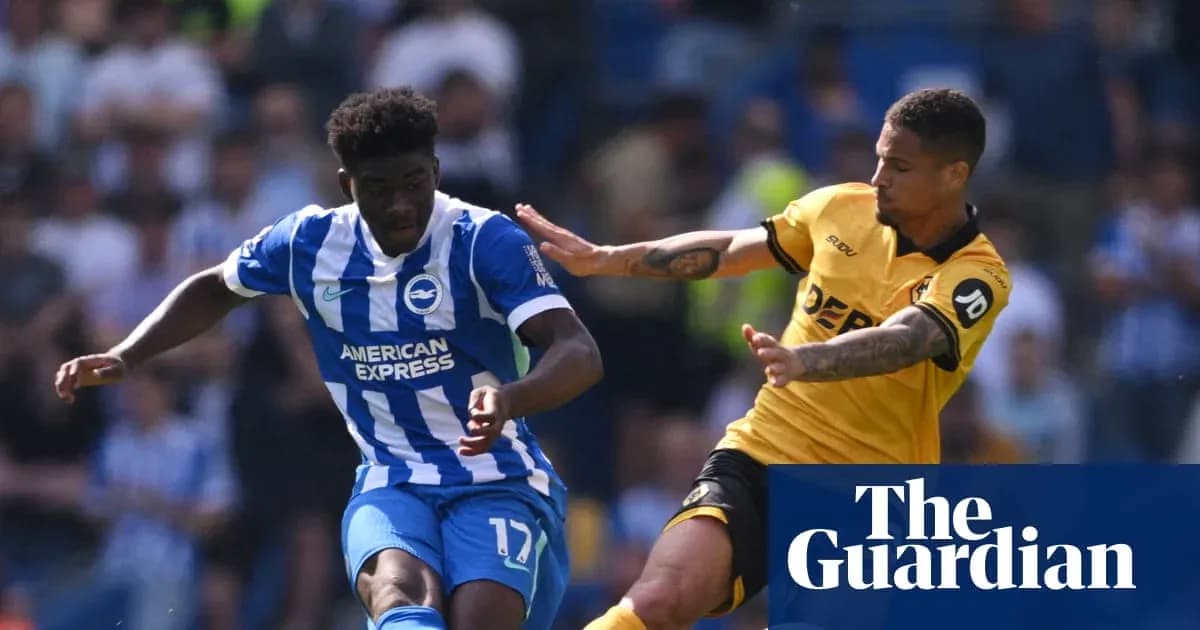 Brighton player dribbling past opponent during match Brighton player dribbling past opponent during match