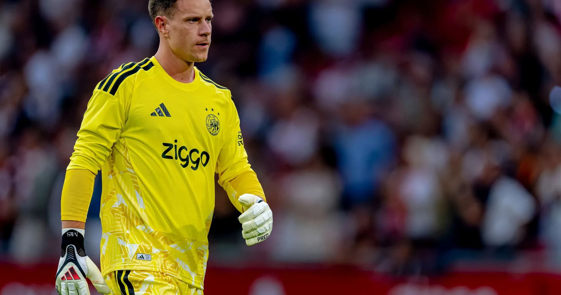 Goalkeeper wearing yellow kit during match Goalkeeper wearing yellow kit during match