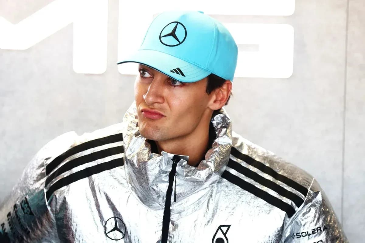 Formula 1 driver in silver jacket and cap Formula 1 driver in silver jacket and cap