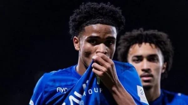 Football player kissing club jersey during match Football player kissing club jersey during match