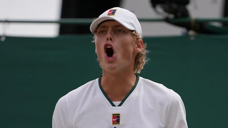 Tennis player celebrating during a match Tennis player celebrating during a match