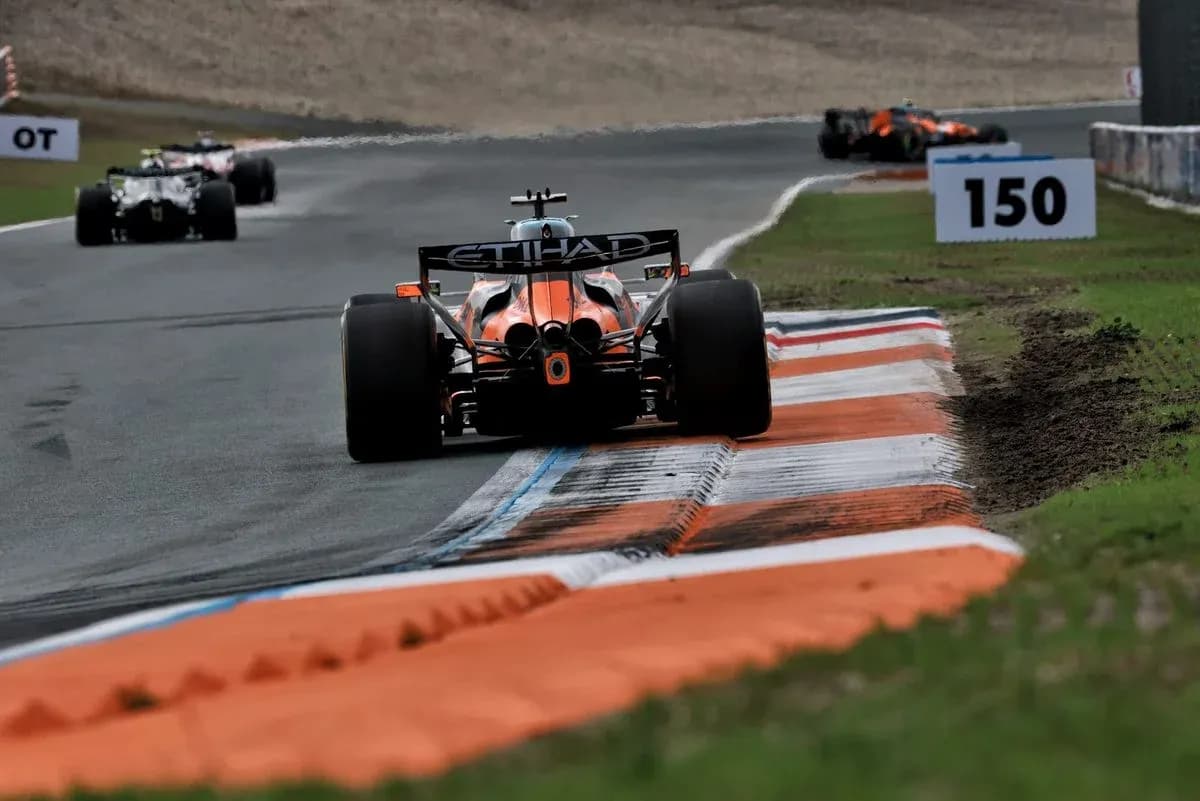 Formula 1 car navigating a turn on track Formula 1 car navigating a turn on track