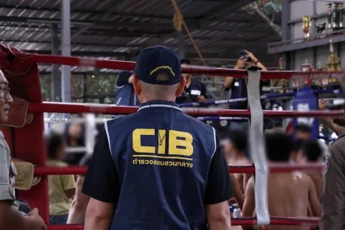 CIB officer observing boxing match in training area CIB officer observing boxing match in training area