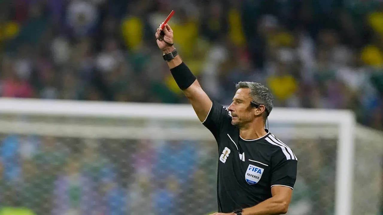 Referee showing red card during football match Referee showing red card during football match