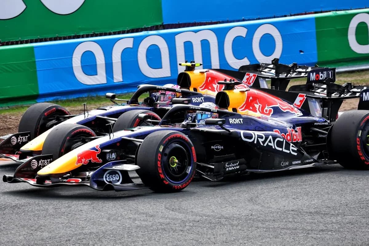 Red Bull Racing cars competing on the track Red Bull Racing cars competing on the track