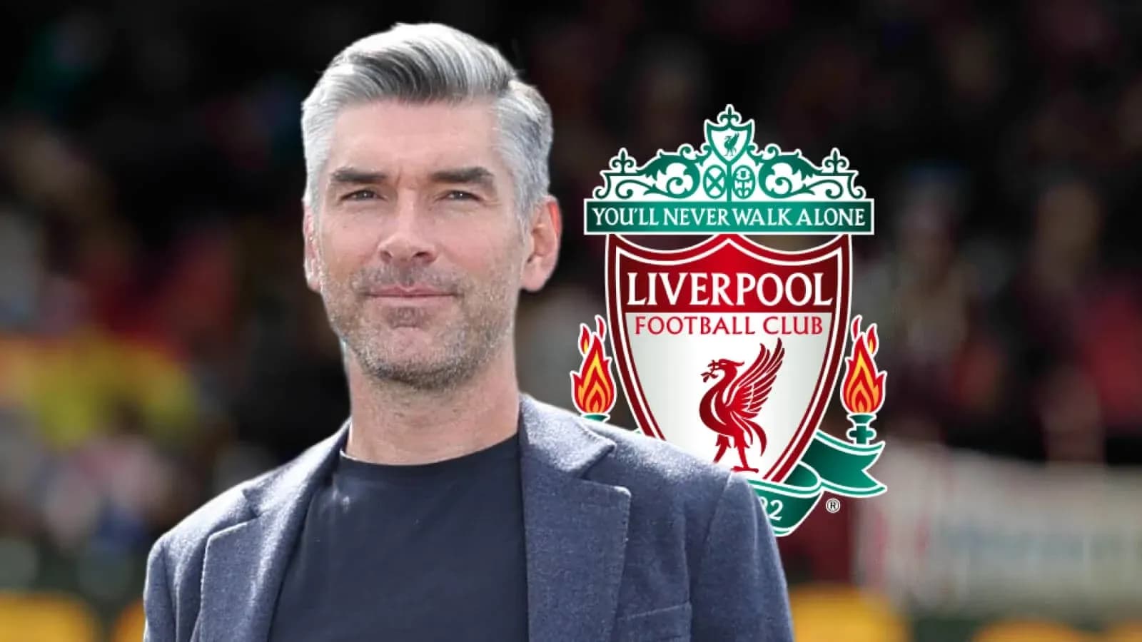 Man standing in front of Liverpool FC logo Man standing in front of Liverpool FC logo