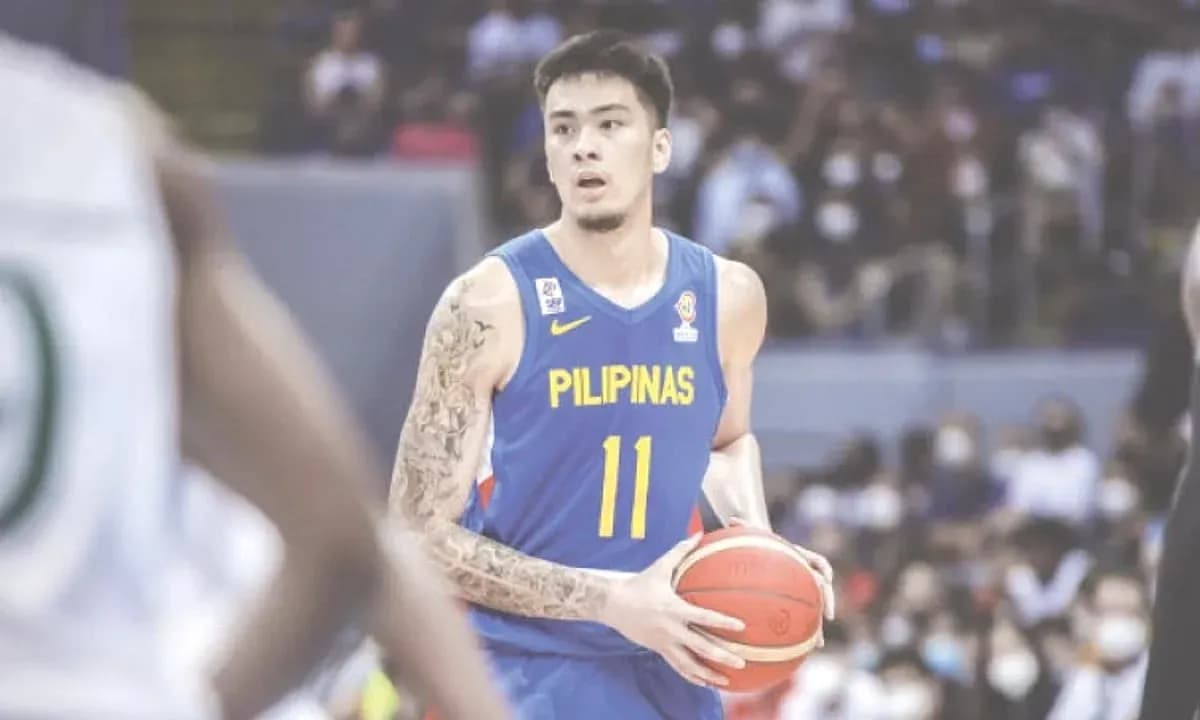 Basketball player in blue jersey holding ball Basketball player in blue jersey holding ball