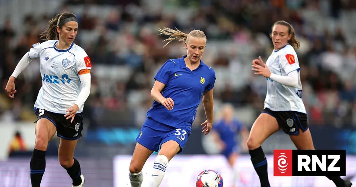 Three female football players competing for the ball Three female football players competing for the ball