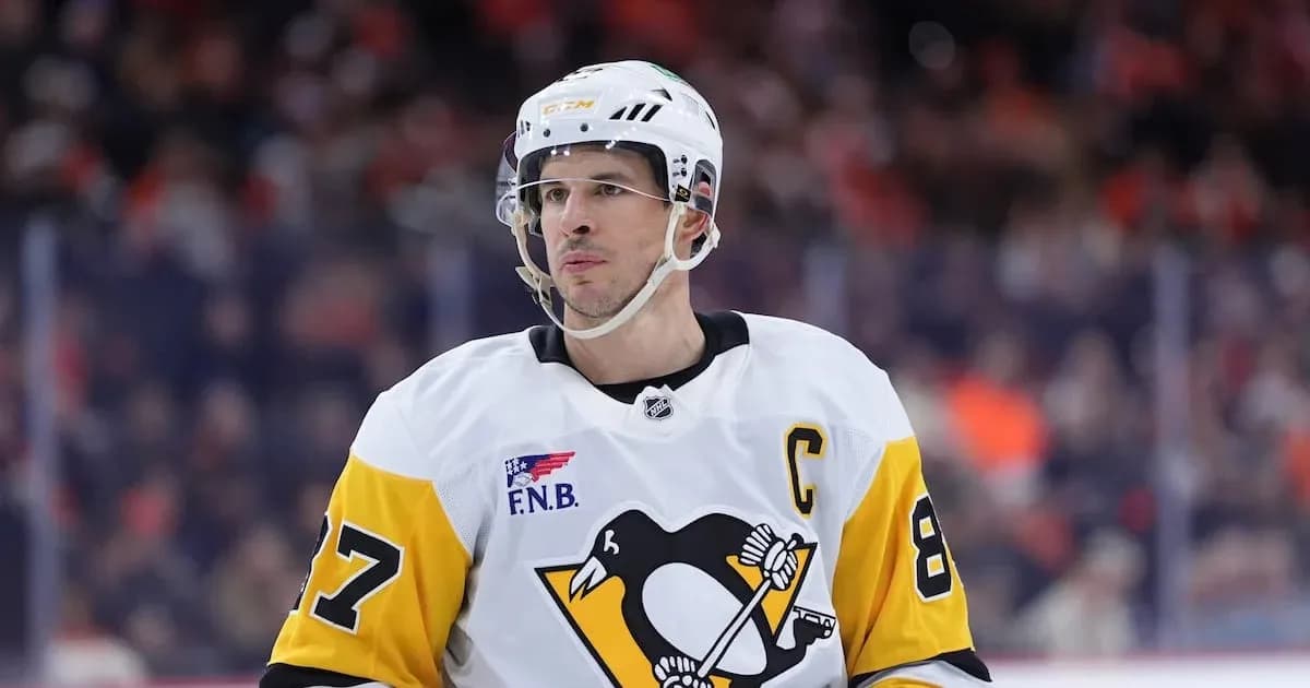 Hockey player in Penguins jersey during game Hockey player in Penguins jersey during game