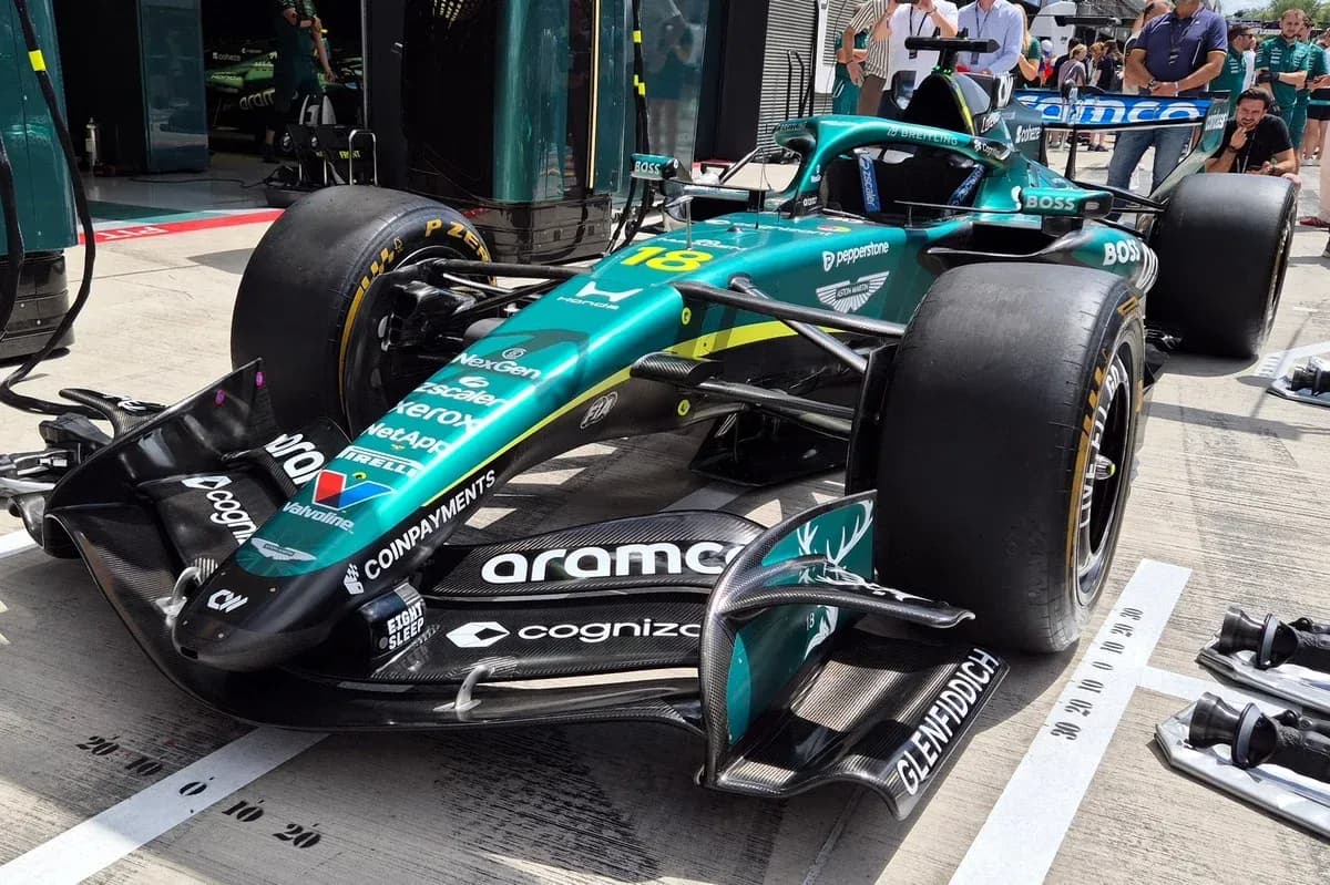 Aston Martin Formula 1 car in pit area Aston Martin Formula 1 car in pit area